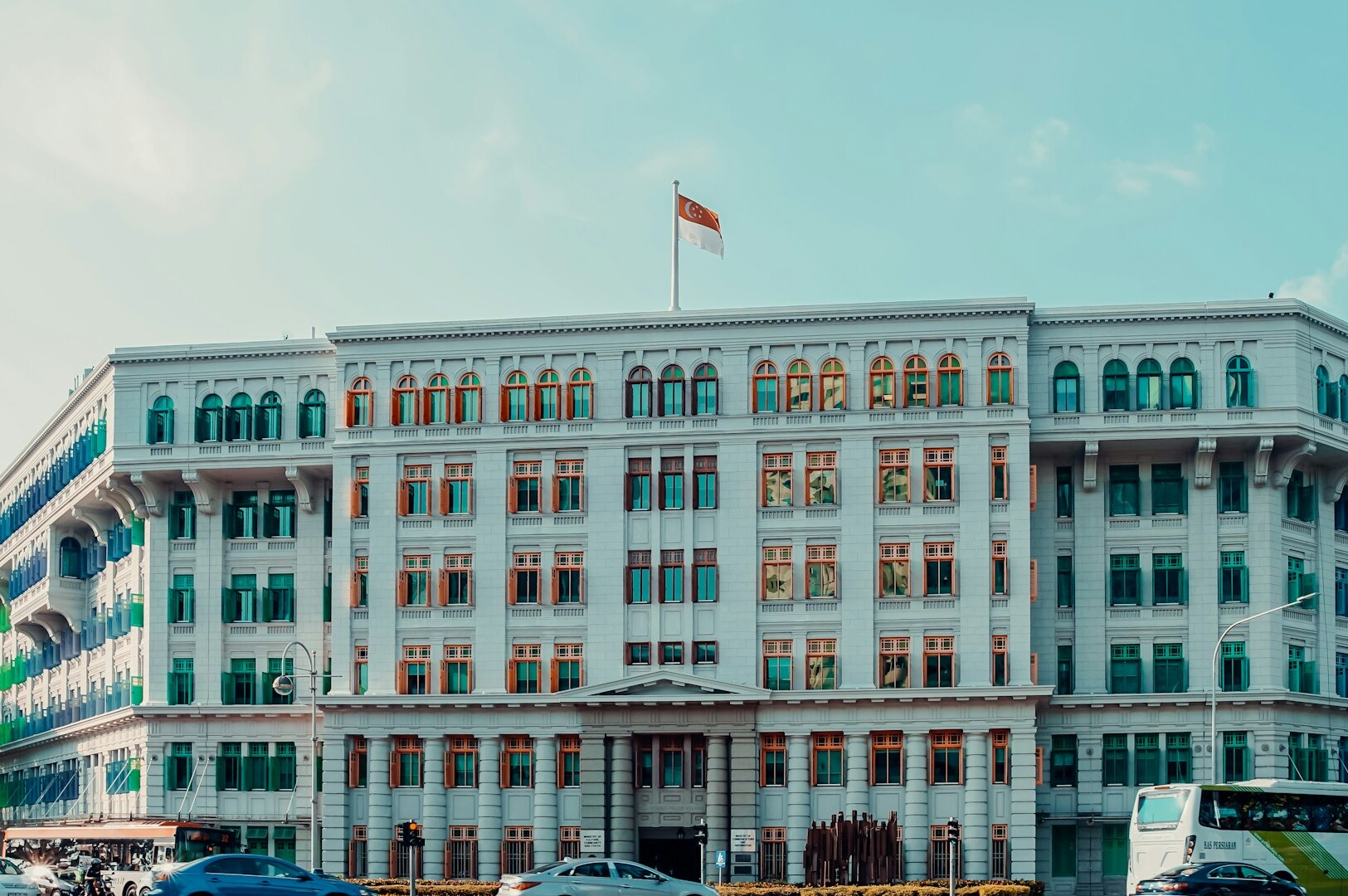 A white, window-filled building showcased in Hill Street Hidden Gems for Foodies on a Budget.