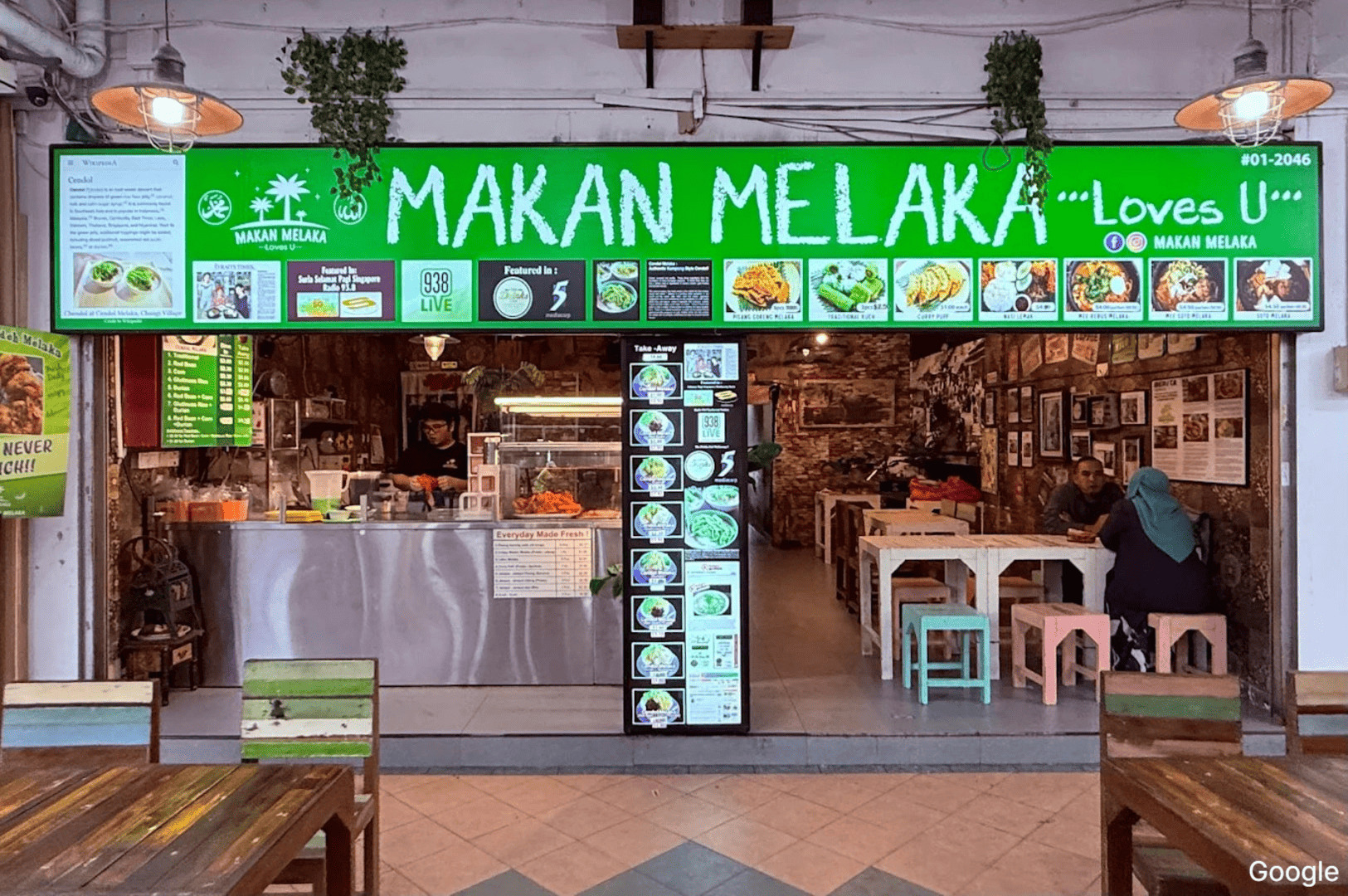 A vibrant restaurant, Cendol Melaka, showcasing green jelly, coconut milk, and sweet syrup, representing love for the dish.