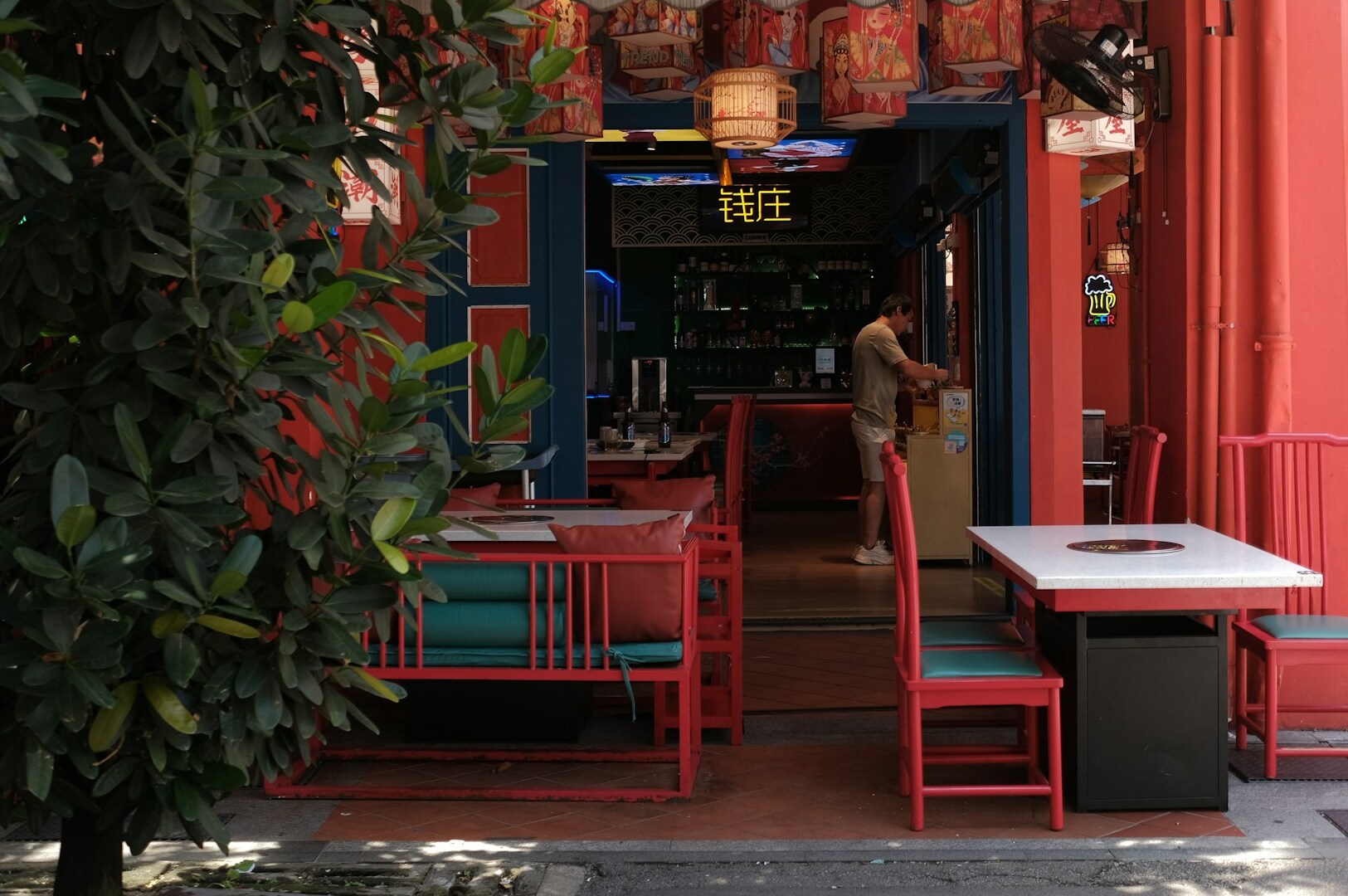 A vibrant red building in Singapore's Chinatown, part of the Food Adventure experience.