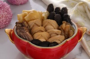 A bowl of Buddha Jump Over the Wall, showcasing an assortment of various food types and ingredients.