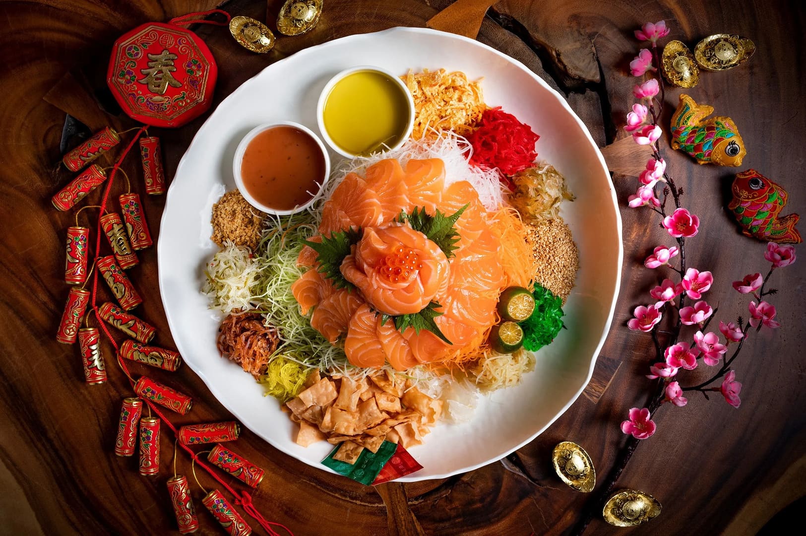 A table set with a plate of Chinese New Year takeaway, showcasing an assortment of festive dishes.