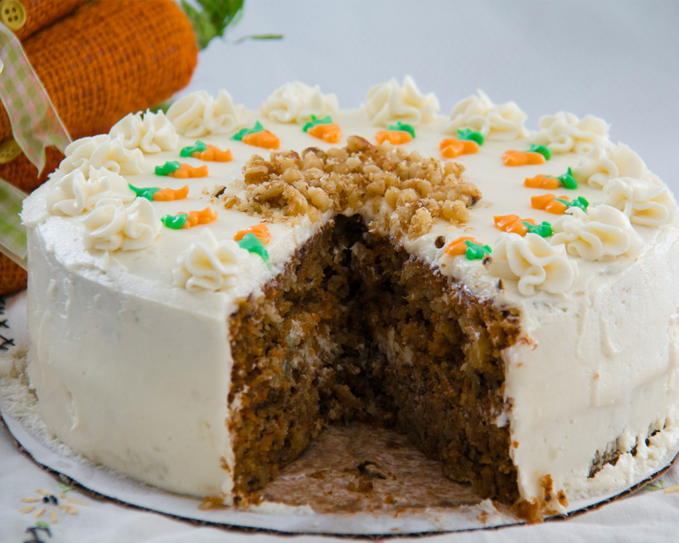 A serving of pan-fried carrot cake with crispy edges, soft interior, and bits of preserved radish and egg, presented on a white plate.