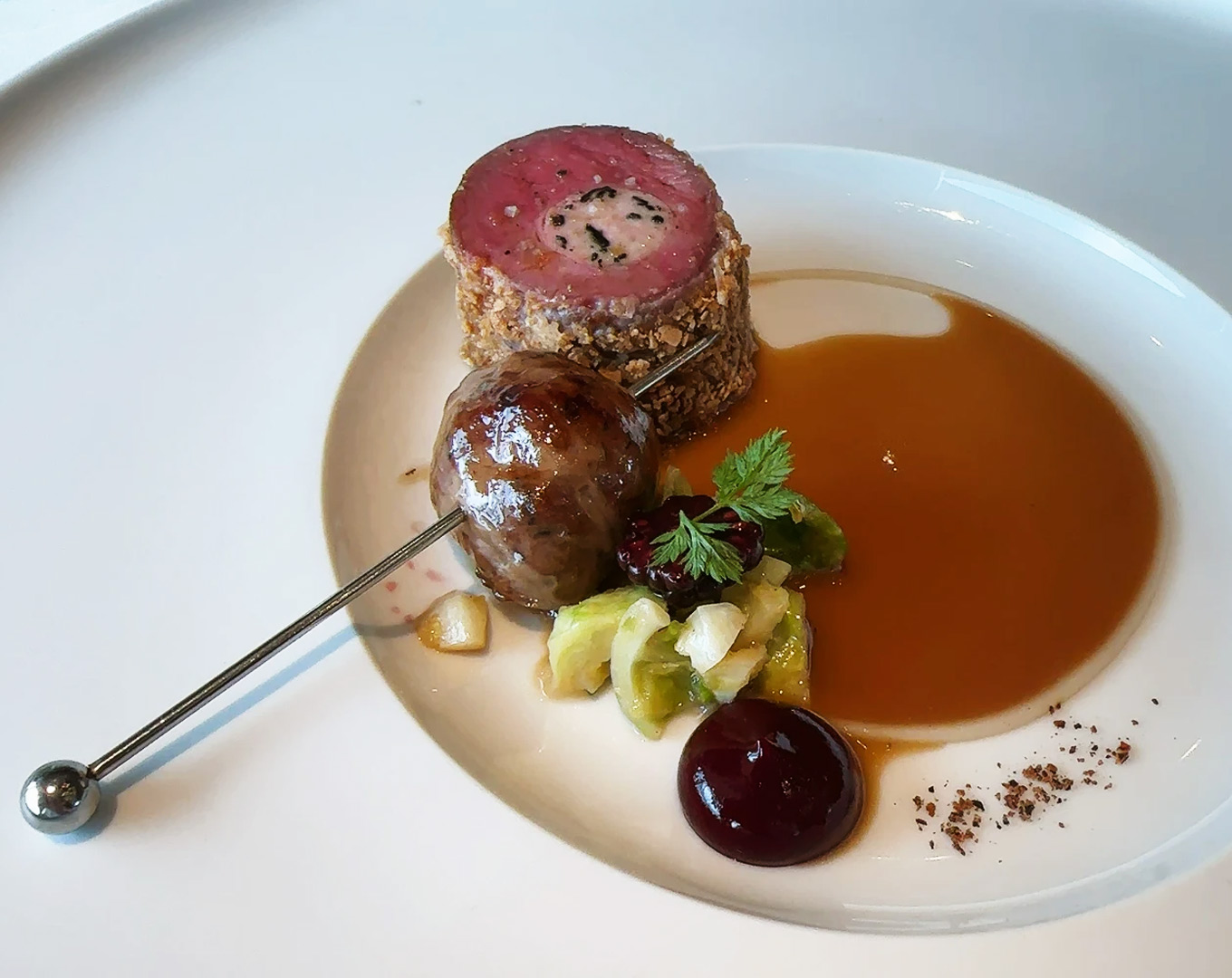 A modern British fine dining dish served with minimalist plating, highlighting premium ingredients and precise culinary execution in an upscale dining setting.