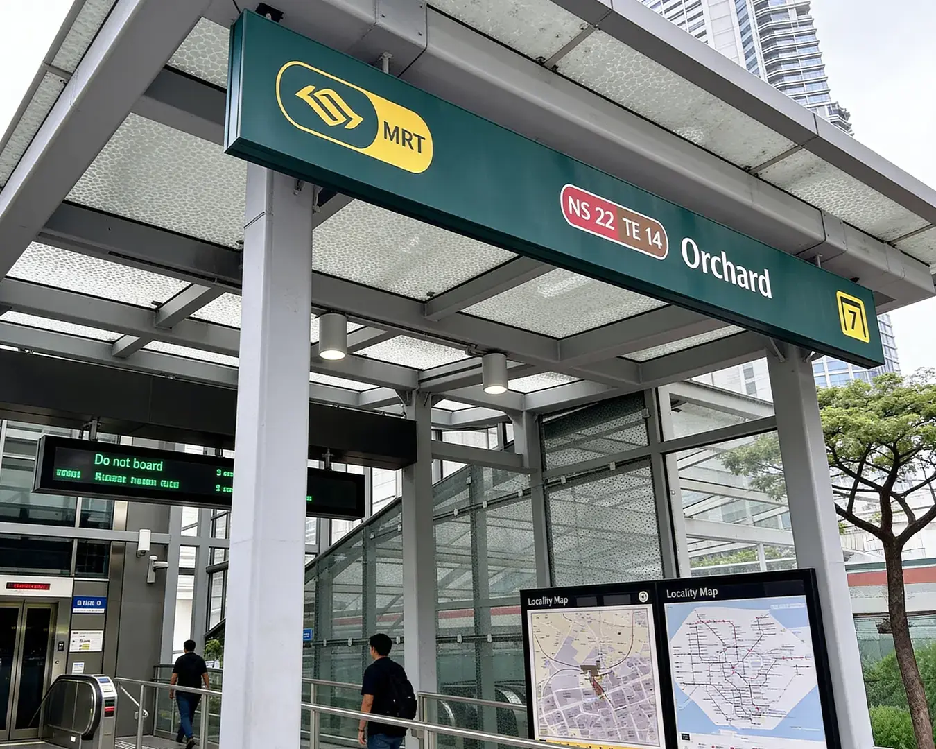 The bright and modern Orchard MRT station signage in Singapore, marking the entrance to one of the city’s busiest transit hubs.
