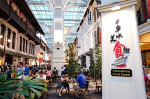 Bustling Chinatown Food Street in Singapore, featuring a variety of food and drink options from local vendors.
