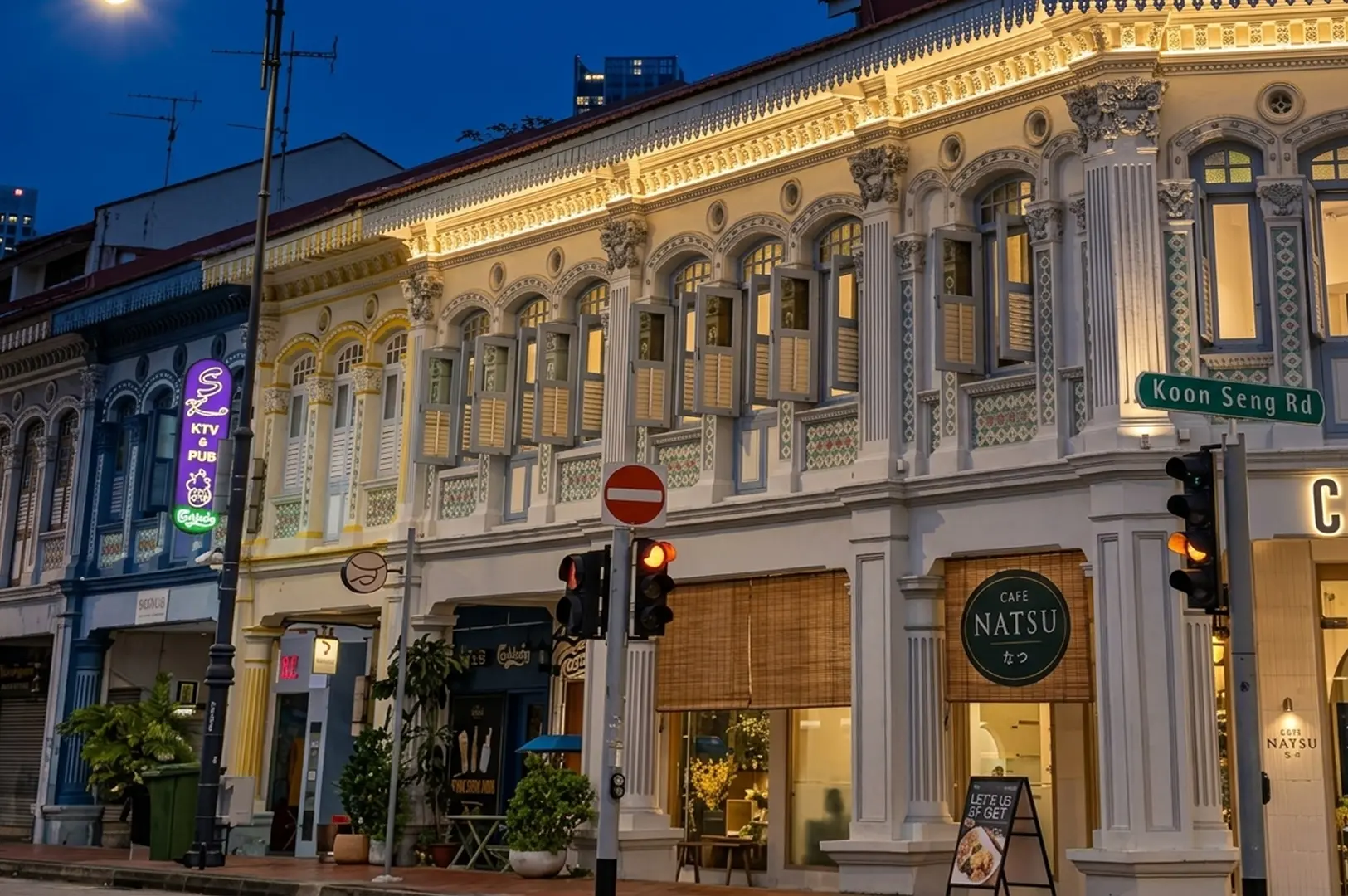 Twilight street view of colorful Peranakan shophouses on Koon Seng Road in Tiong Bahru, featuring vintage architecture and quaint cafes like Cafe Natsu for a romantic date night
