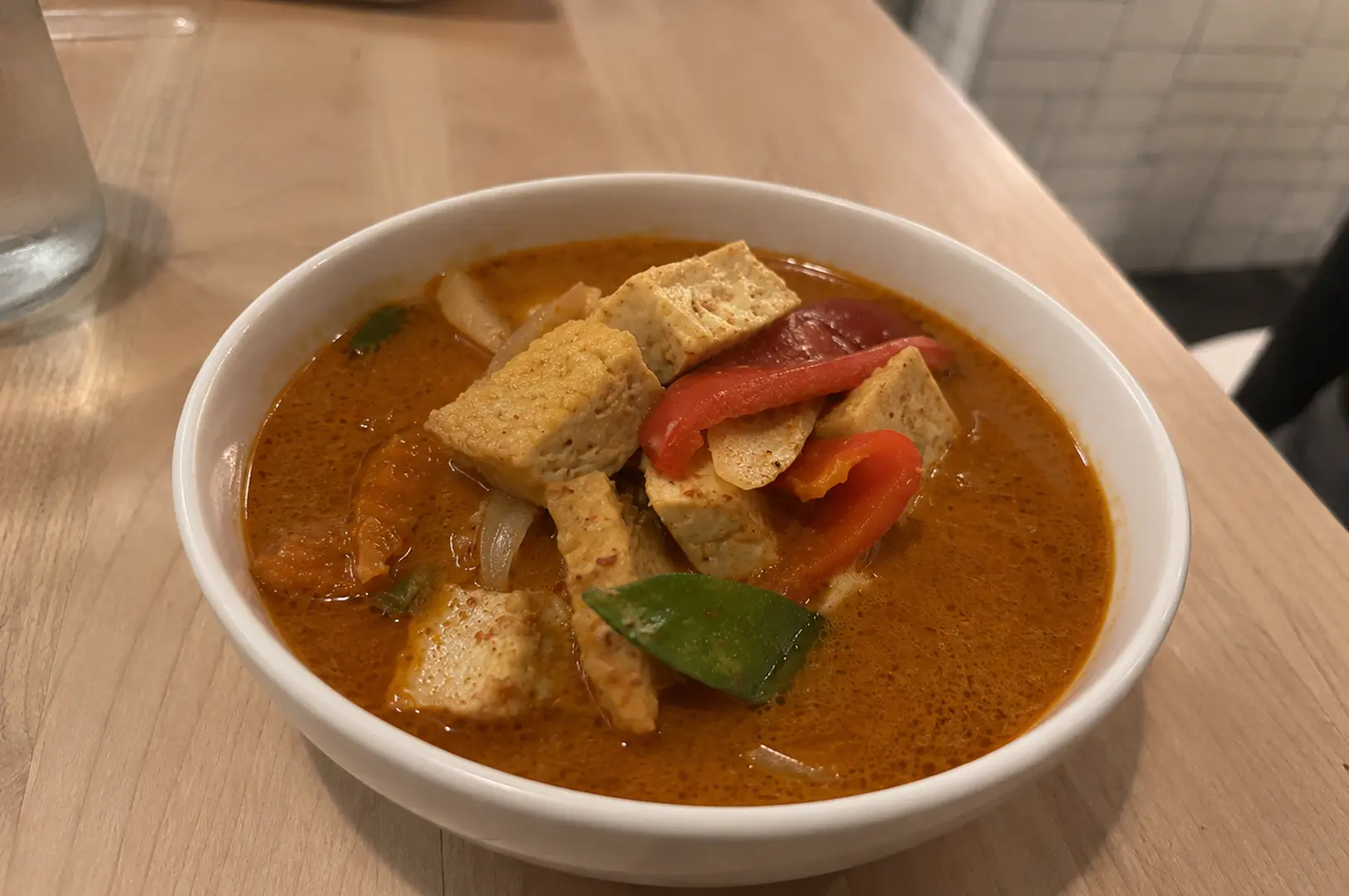 Bowl of Japanese soup curry with tofu and vegetables