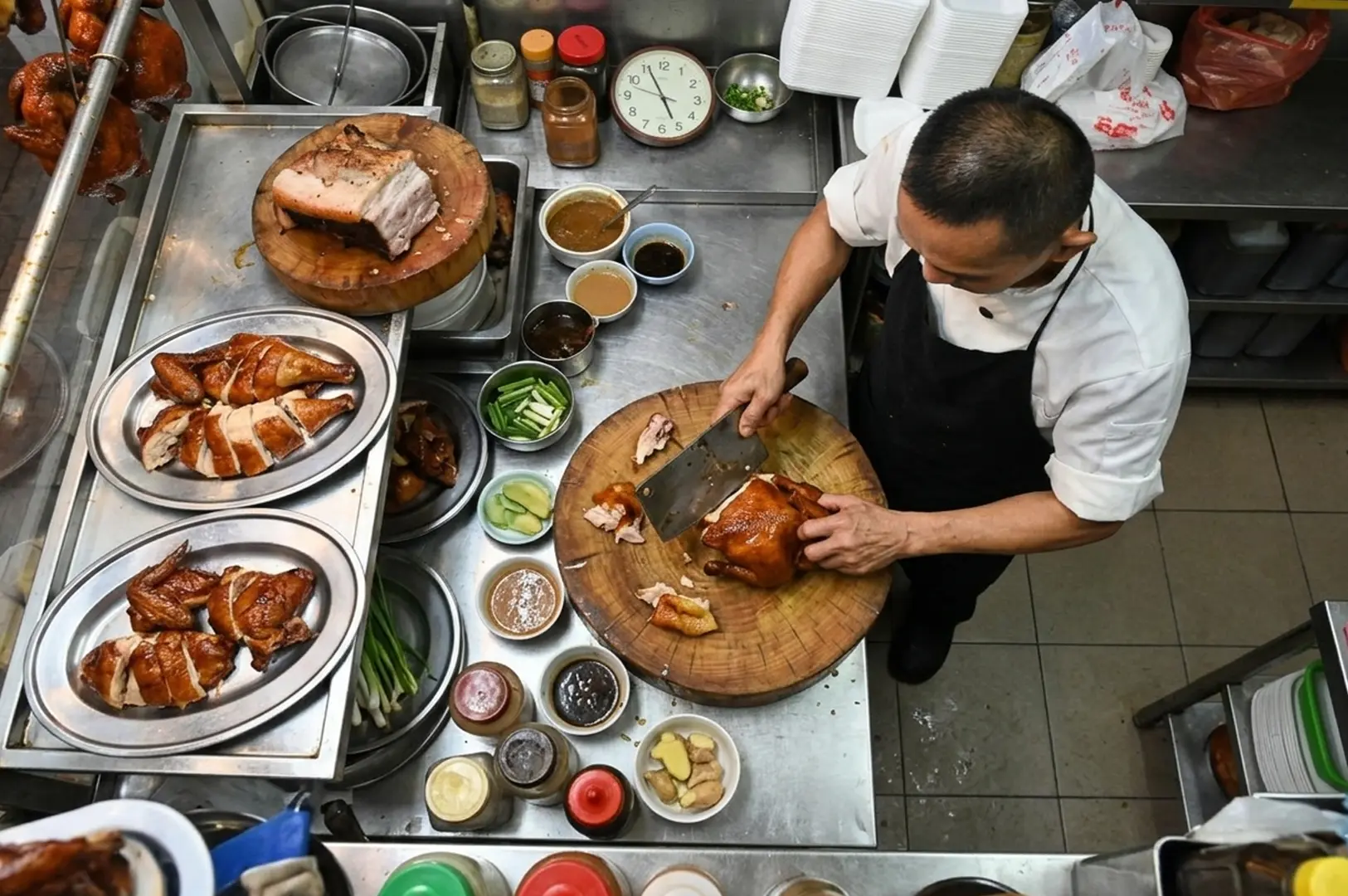 Hawker chef chopping roasted meat