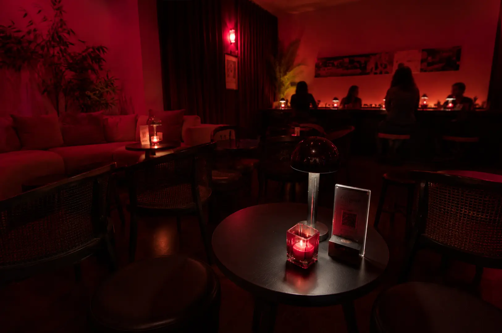 APT's intimate seating areas, showcasing the café's cozy layout, limited seats, and warm after-dark ambiance perfect for quiet conversations.
