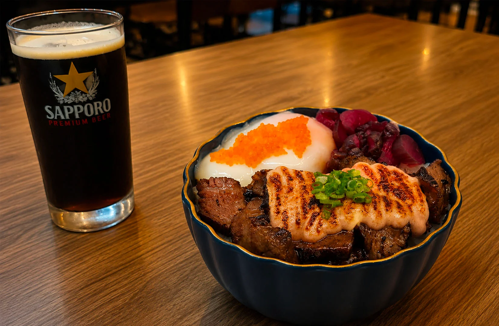 Waa Cow! at CIMB Plaza Singapore serving premium grilled beef rice bowl with beer.