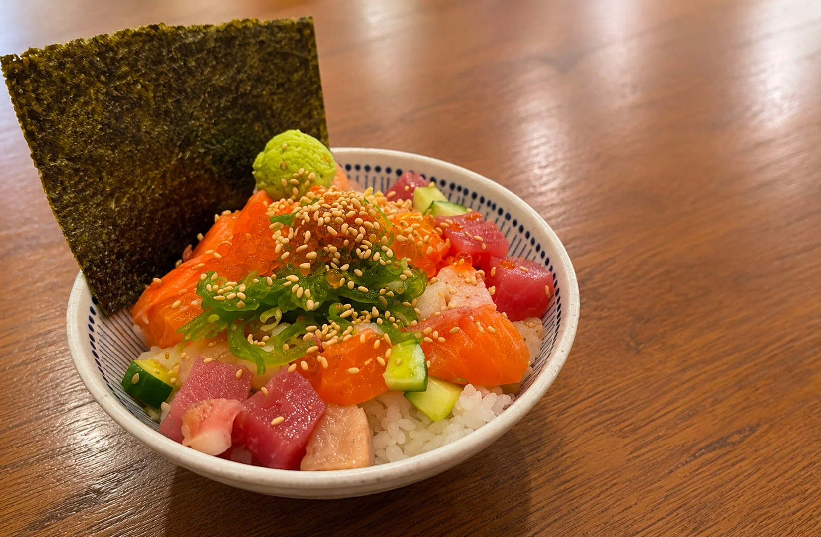 Sea urchin and negitoro rice bowl with wasabi and pickled ginger.