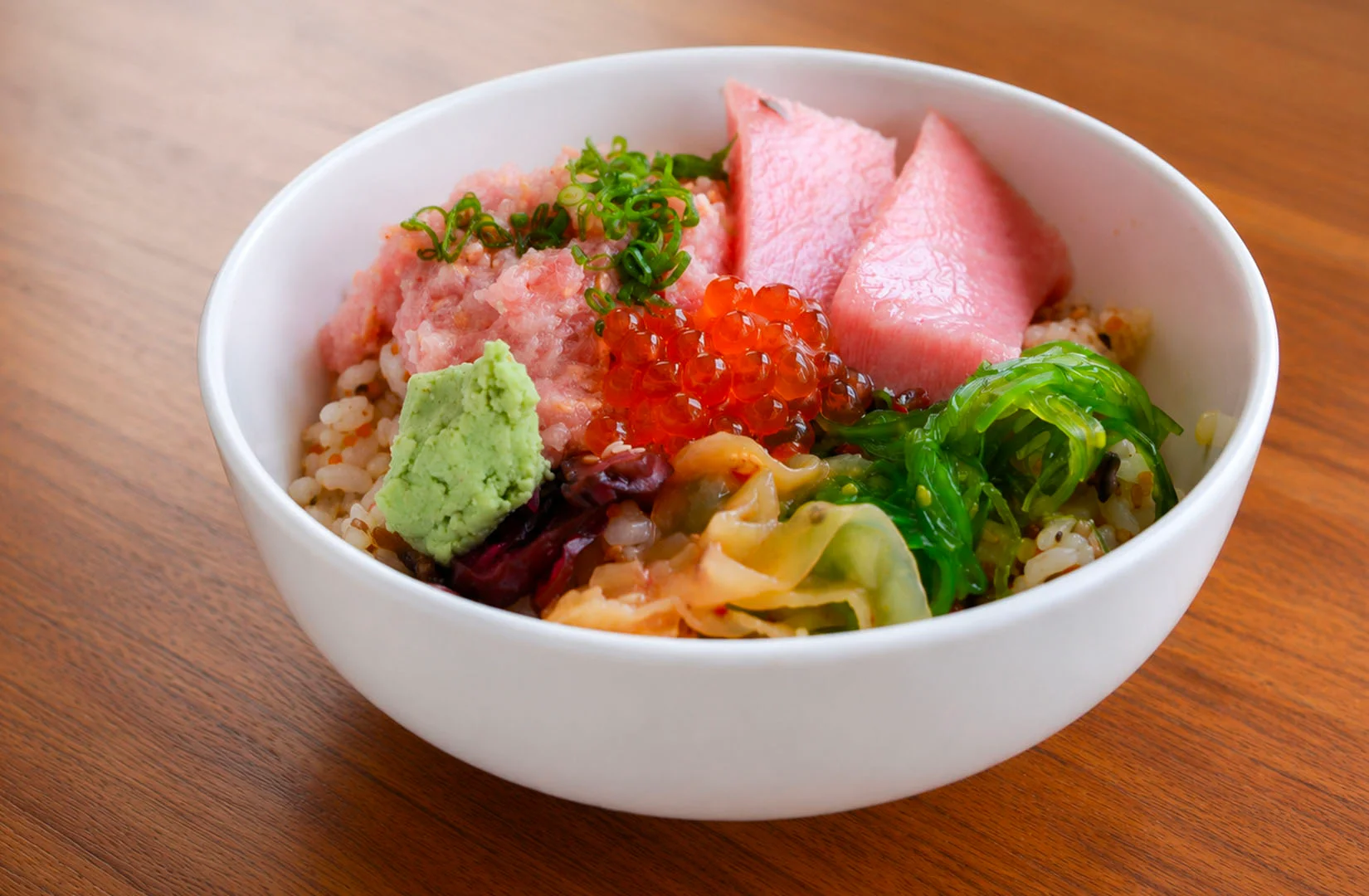 Premium salmon and mixed sashimi rice bowl with salmon roe.