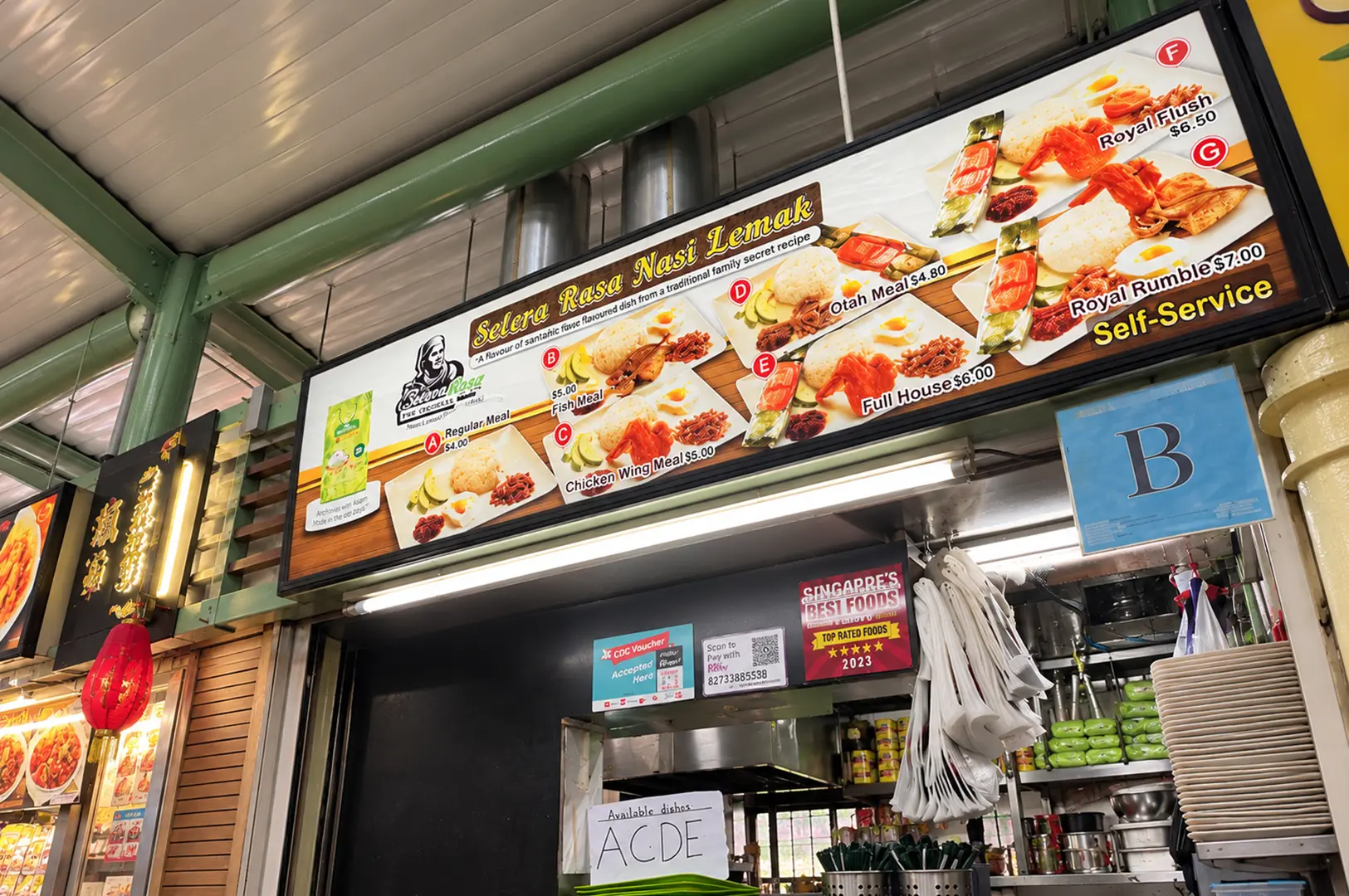 Selera Rasa Nasi Lemak stall sign displaying several nasi lemak meal options with prices.